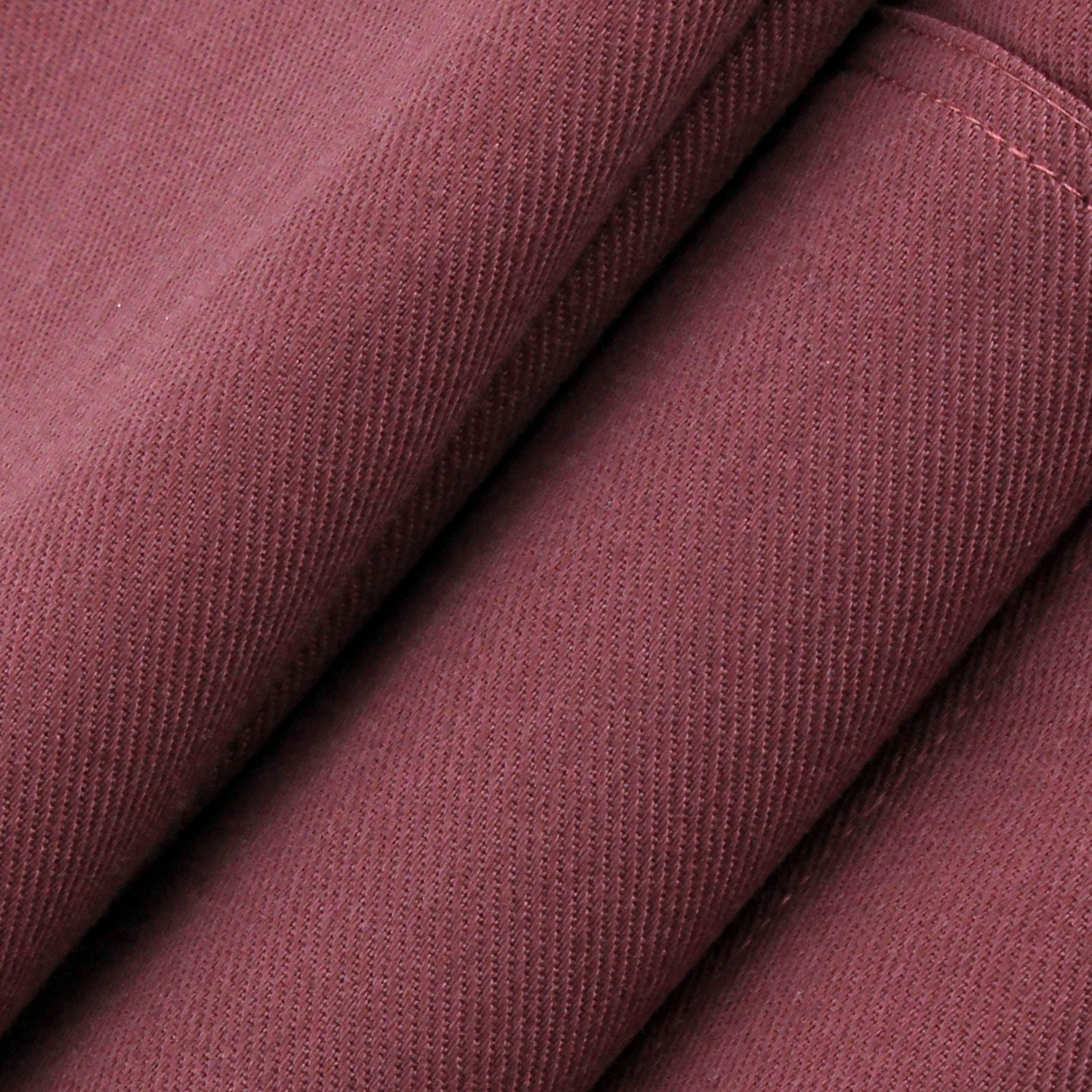 Close-up of maroon fabric with visible texture